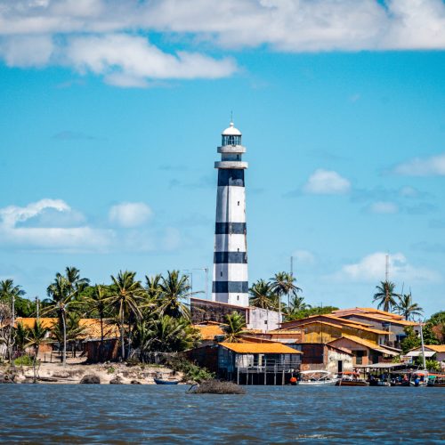 lighthouse-by-sea-against-sky